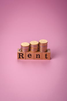Small wooden house and the inscription for rent. Concept for sale, rental of real estate for a family photo