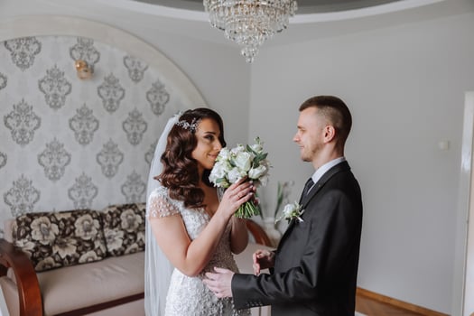 the first meeting of the bride and groom on the wedding day in the bride's room. photo