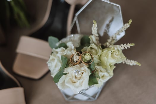 Details of the bride. Beauty is in the details. High-heeled bridal shoes. Gold wedding ring with a diamond. Perfumes. Earrings Wedding in details. photo
