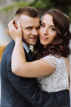 Wedding. Love and couple in garden for wedding. Celebrating the ceremony and commitment. Save the date. Trust. The groom embraces the bride. Tender kisses. Couple in love. Wedding portrait photo
