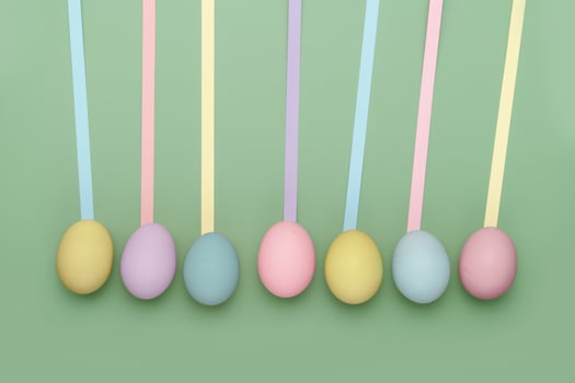Row of eggs with leading geometric lines. Fun Easter background photo