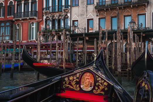 Tranquil Scene of Moored Gondolas on Deep Blue Water in Venice, Italy photo