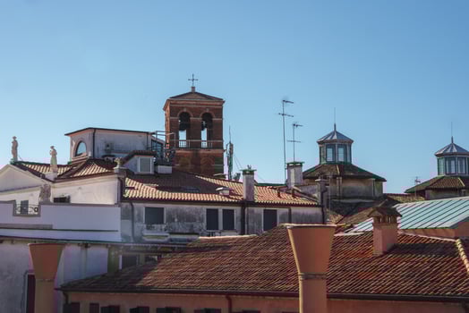 Sunny Urban Cityscape View from Above on Clear Day with Rooftops and Streets photo