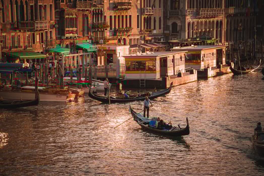 Sunset Gondolas Iconic Venetian Boats on Grand Canal at Dusk in Warm Tones photo