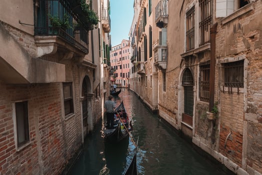 Serene Gondola Ride Through Charming Venetian Canals - Iconic Waterway Scene photo