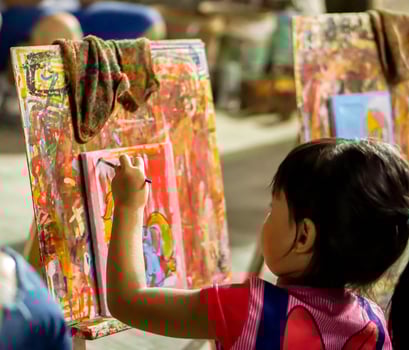 Lampang, Thailand, 2023 - Asian little girl study and learning paint on canvas in the art classroom of her school. photo