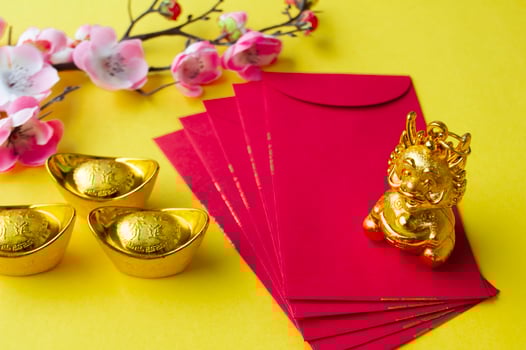 Golden Dragon on top of Chinese New Year red packet. Chinese New Year celebration concept photo