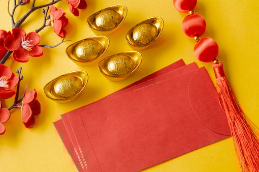 Chinese New Year red packet and golden ingot with customizable space for text or wishes. Chinese New Year celebration concept. photo