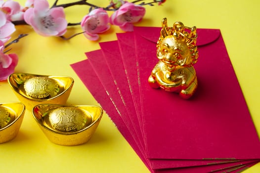 Golden Dragon on top of Chinese New Year red packet. Chinese New Year celebration concept photo