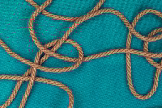 Ship rope on blue background, top view with copy space photo