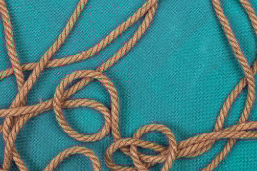 Ship rope on blue background, top view with copy space photo