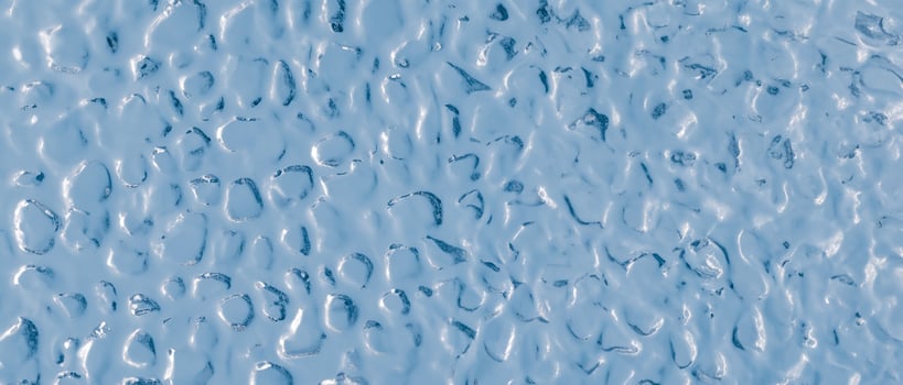 Background of uneven convex glass texture with ripple effect, water or ice imitation. photo