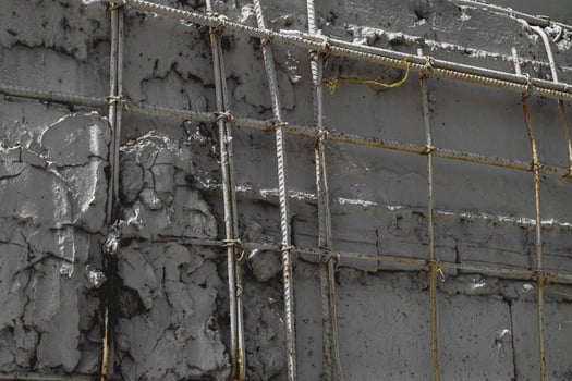 Crack of wall construction with steel bar. photo