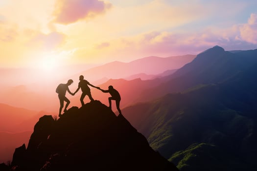 AI generated Silhouette three people helping each other hike up a mountain at sunrise or sunset. Giving a helping hand. Travel hiking journey concept. photo