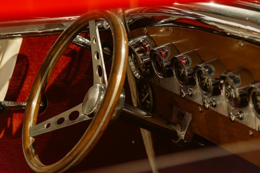 Red hot rod interior with metal gauges photo