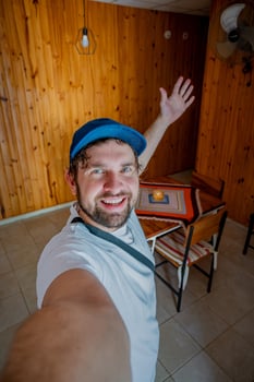 Man takes a selfie entering an apartment. photo