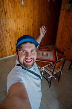 Selfie of a young adult entering an apartment in Latin America. photo