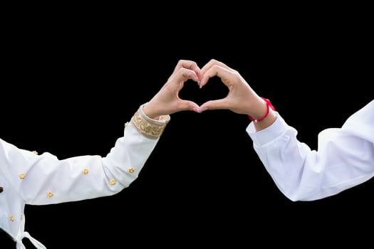 woman raised her hands and made heart symbol to express meaning of love friendship and kindness to her friends and lovers. woman uses her hands to make a heart symbol that means love and friendship. photo