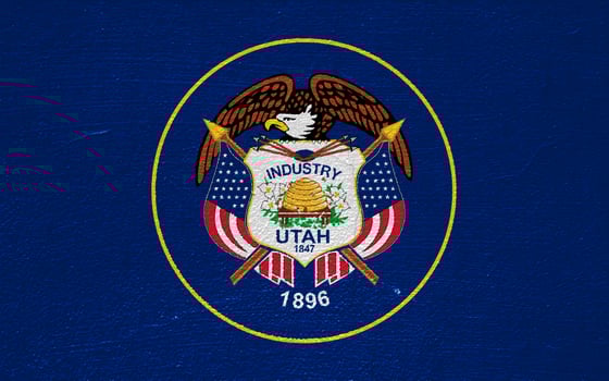Flag of Utah USA state on a textured background. Concept collage. photo