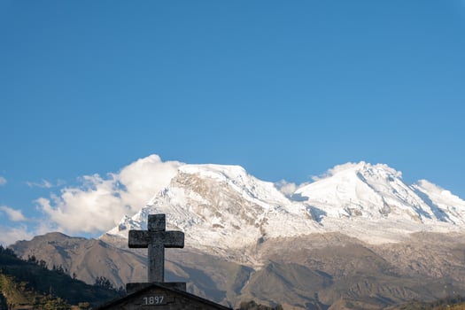 Snow-capped Huascaran mountain seen from the cemetery of the town called Yungay in Huaraz, Peru. photo