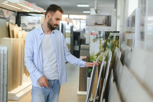 Man choosing tiles at building market photo