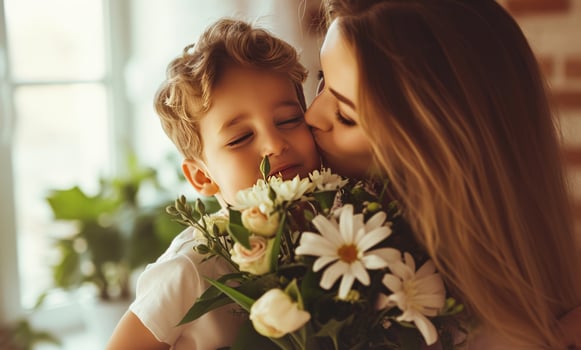 AI generated mother kisses son at home holding flowers for mothers day photo