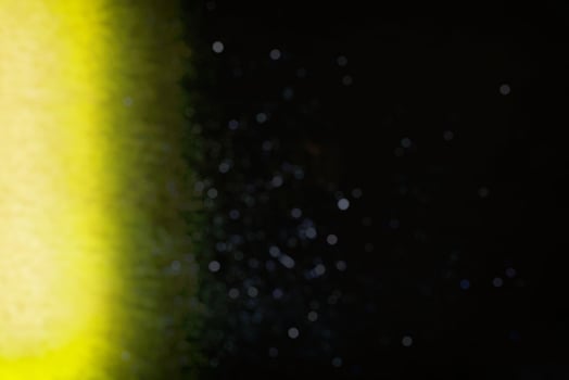Abstract Blurred Light Beam on Wall with particle Bokeh Background. photo