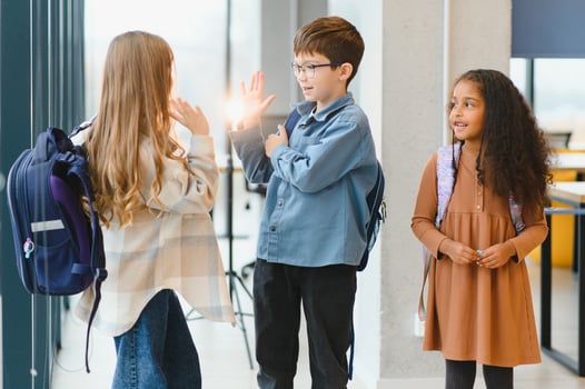 Portrait of kids standing in elementary school hallway photo