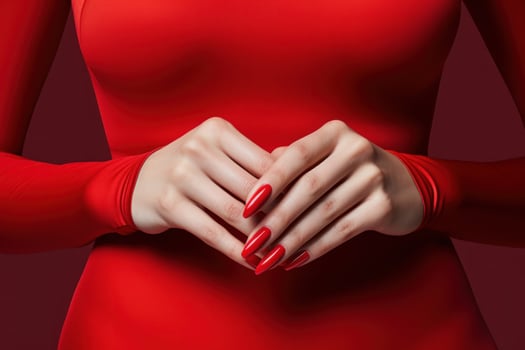 AI generated woman's hands holding red manicures. photo