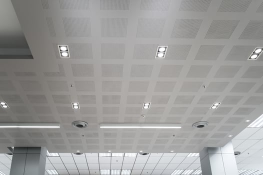 Ceiling mounted cassette type air conditioner and modern lamp light on white ceiling. Duct air conditioner for home, hall or office. photo
