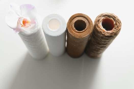 used water filters, glasses with dirty water photo