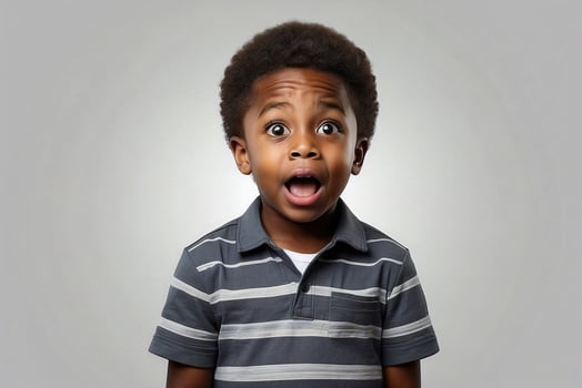 AI generated Studio portrait of a young black boy, looking at the camera with a surprised expression on his face. Isolated on a plain background. photo