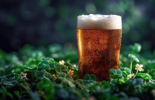 AI generated a beer is surrounded by a green shamrock and a shamrock photo