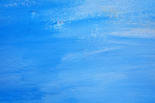 Blue Brush Stroke Painting on Concrete Wall Texture Background. photo