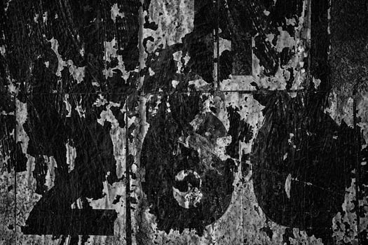 Old Peeling Vintage Posters on Grunge Concrete Wall Texture Background. photo