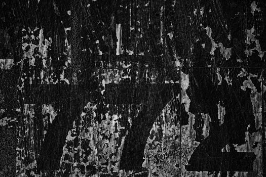 Old Peeling Vintage Posters on Grunge Concrete Wall Texture Background. photo