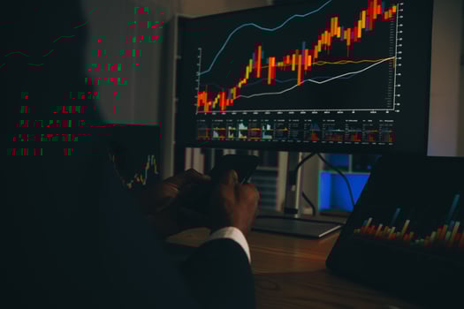Thoughtful focused successful caucasian male stock investor, broker, financial adviser, sits at work desk, looks at computer, pensively analyze risks and prospects, rise or fall of cryptocurrency coin photo