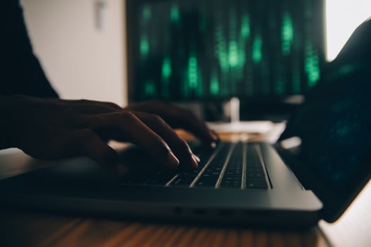 Hacker code in laptop. Cyber security, privacy or hack threat. Coder or programmer writing virus software, malware, internet attack or developing digital design. Green web data in computer screen. photo
