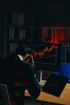 Thoughtful focused successful caucasian male stock investor, broker, financial adviser, sits at work desk, looks at computer, pensively analyze risks and prospects, rise or fall of cryptocurrency coin photo