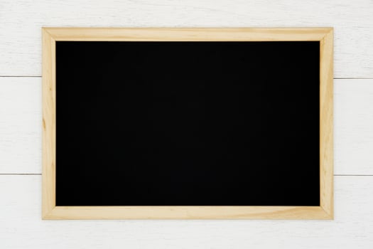 Blank chalkboard on white wood plank background. photo