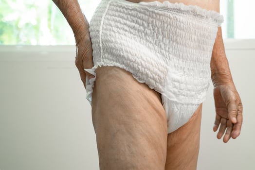 Asian senior woman patient wearing incontinence diaper in hospital, healthy strong medical concept. photo