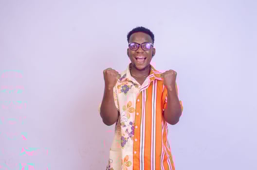 It's incredible Portrait of a happy and excited man looking up with mouth open and both arms up photo