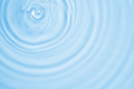 Abstract transparent water shadow surface texture natural ripple on blue background photo