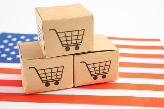 Box with shopping online cart logo and USA America flag, Import Export Shopping online or commerce finance delivery service store product trade, supplier. photo