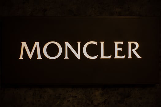 Milan, Italy December 4. 2023, new Moncler shop window in via Monte Napoleone at night. Montenapoleone District. Il quadrilatero della moda photo