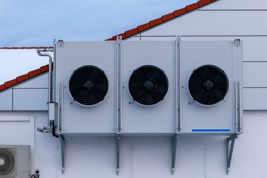 heat pump on a house wall photo