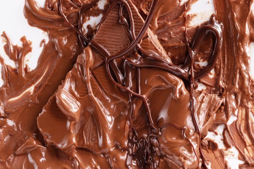 Sweet melted chocolate background. Mass of chocolate. photo