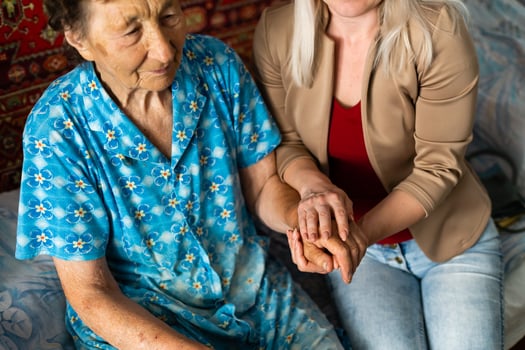 Senior woman with her home caregiver photo