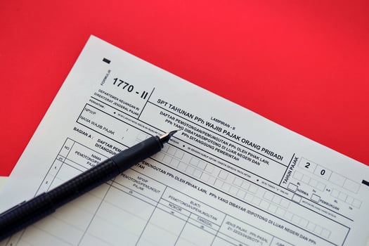 Indonesian tax form 1770-2 Individual Income Tax Return and pen on table photo