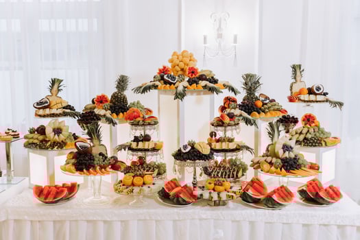 Fruit buffet for a wedding. Assortment of exotic fruits in the restaurant. Various compositions from fresh fruits. photo